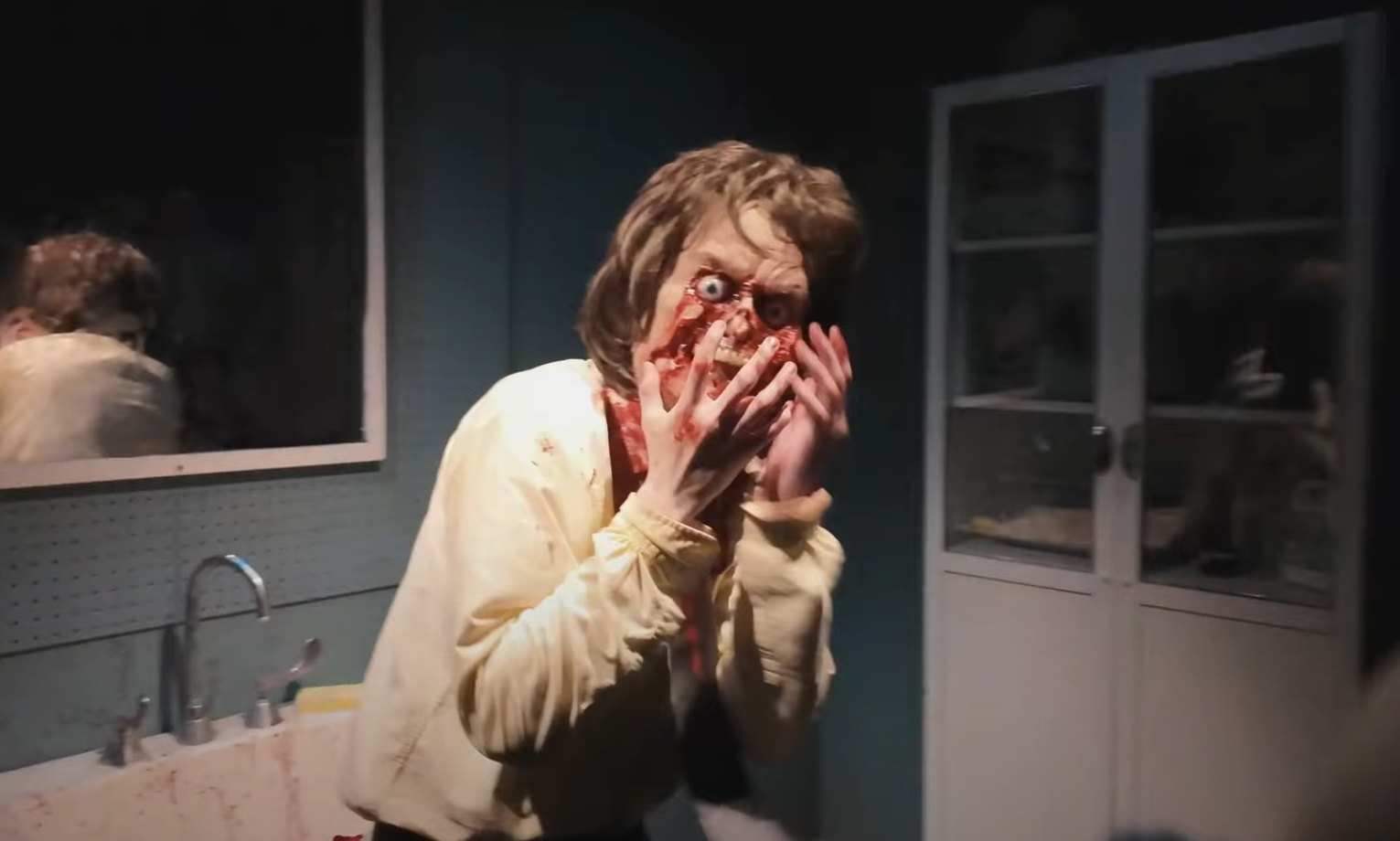 Ryan portraying the facepeel scene in Poltergeist