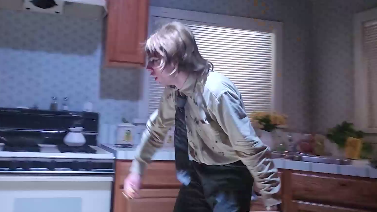 Ryan portraying the kitchen scene in Poltergeist